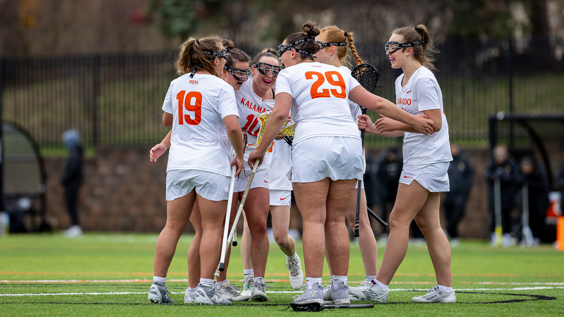 The Kalamazoo College women's lacrosse team celebrating a goal