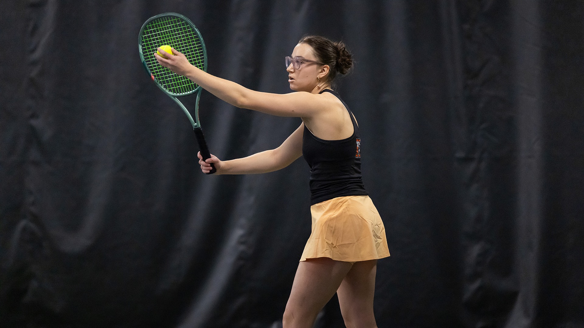 Addison Lyons playing tennis