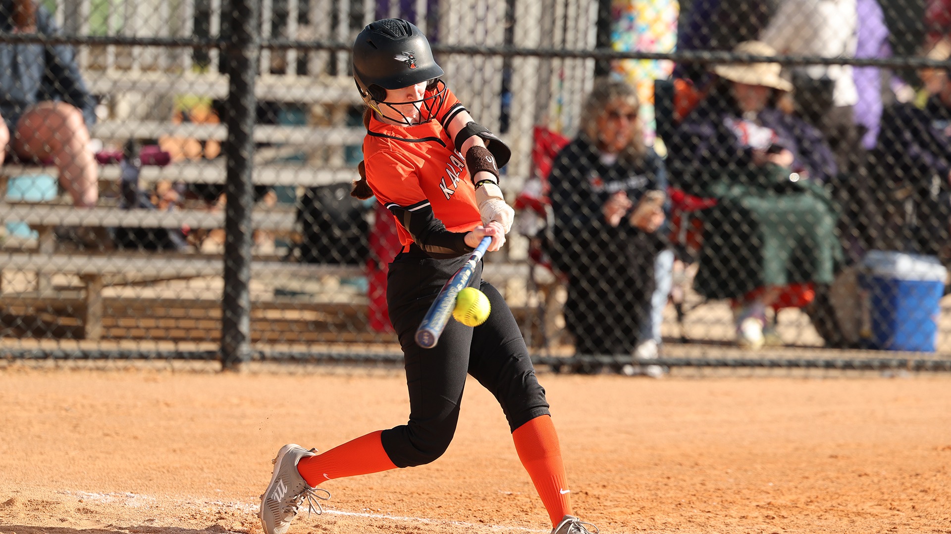 Macy Ward playing softball