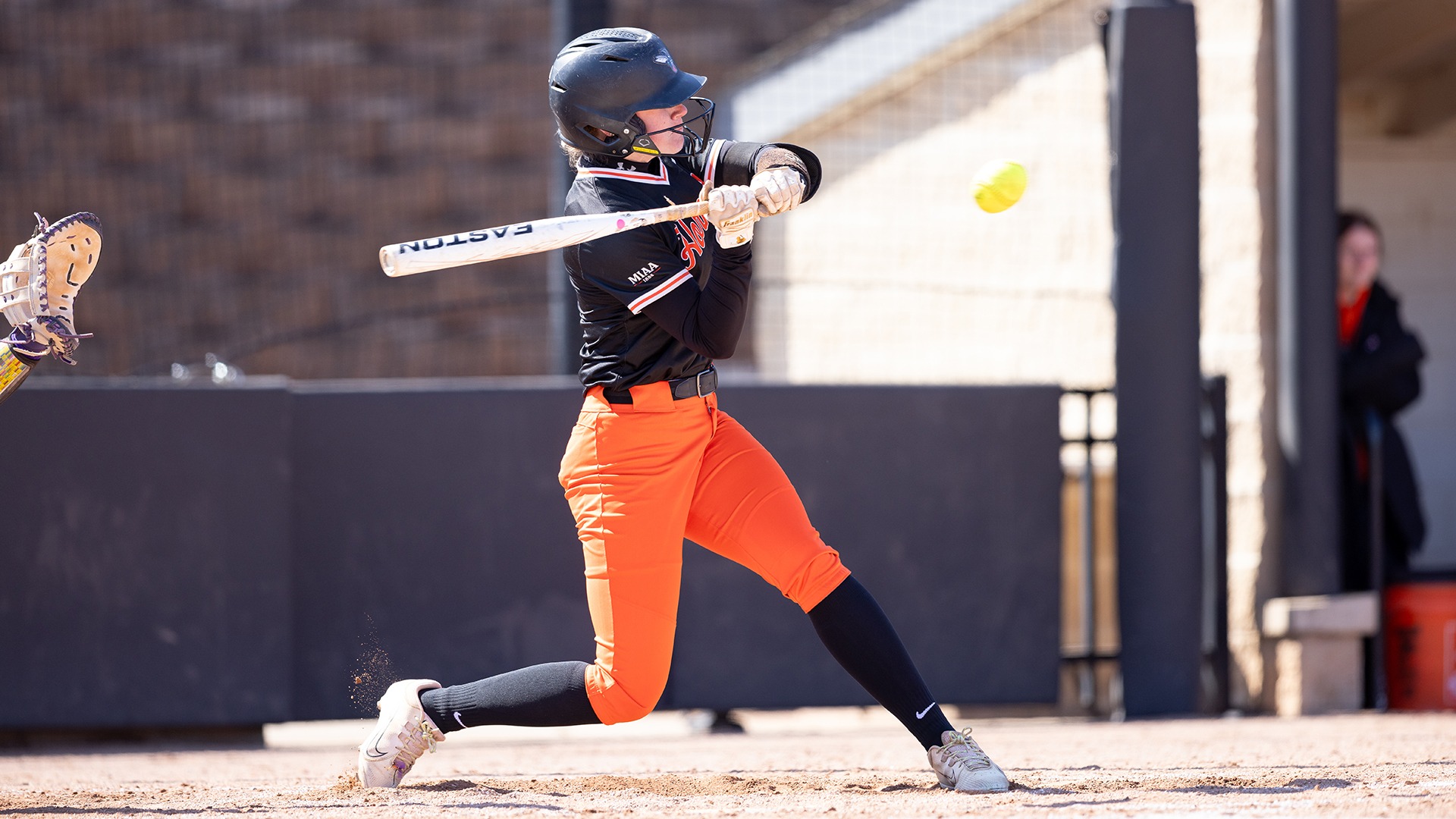 Landrie Fridsma playing softball