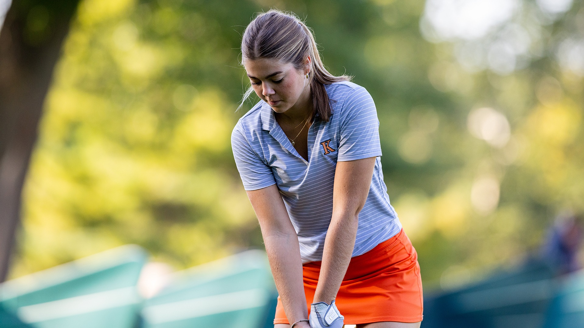 Jacey Merkle playing golf