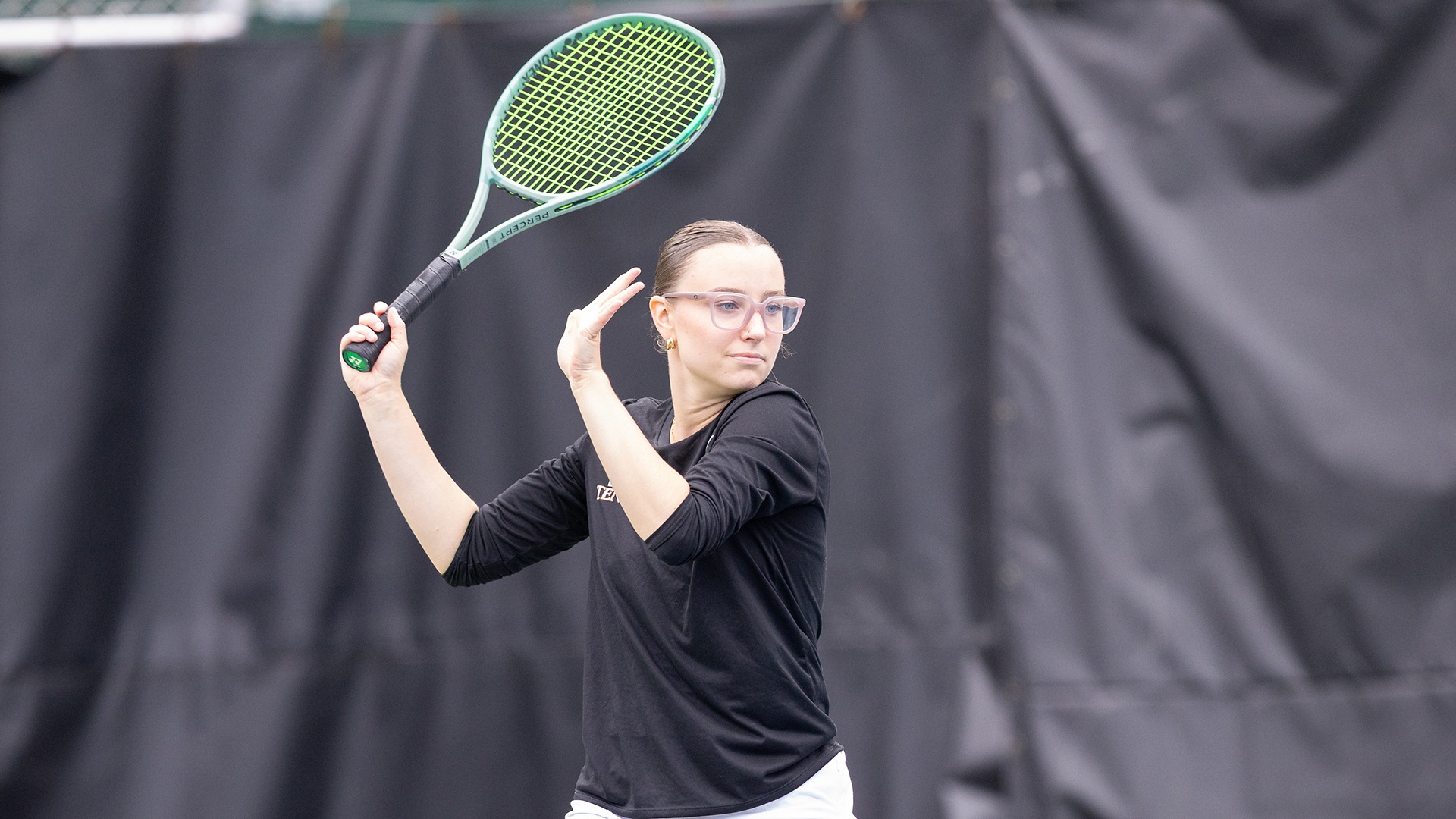 Addison Lyons playing tennis