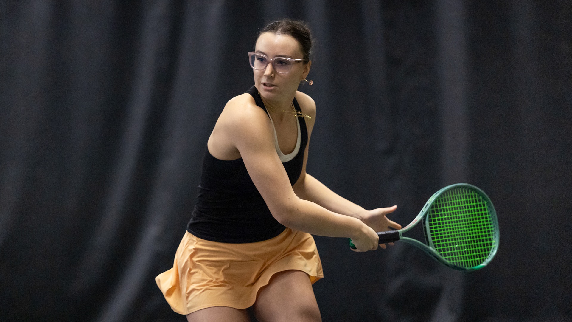 Addison Lyons playing tennis
