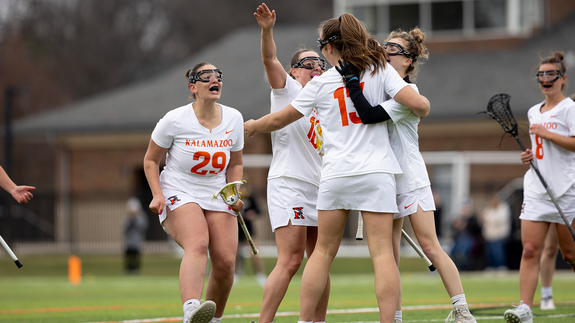 The Kalamazoo College women's lacrosse team celebrating a goal