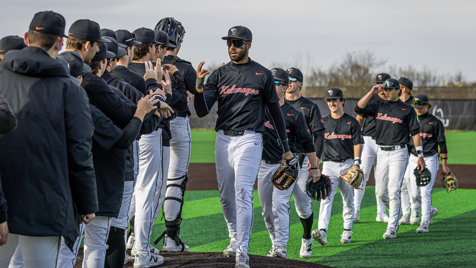 The Kalamazoo College baseball team celebrating a win