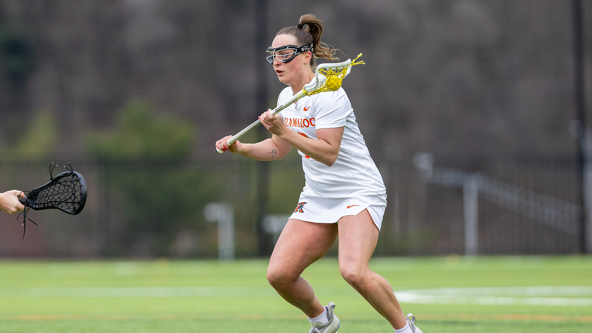 Ella Spooner playing lacrosse