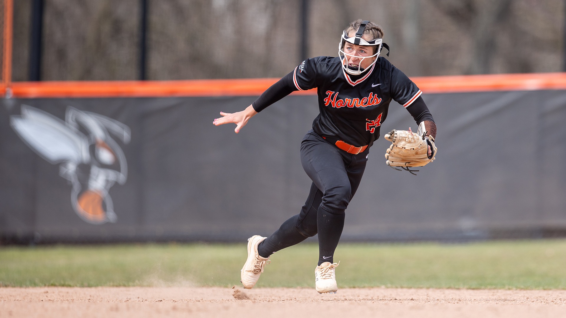 Emma Newlove playing softball