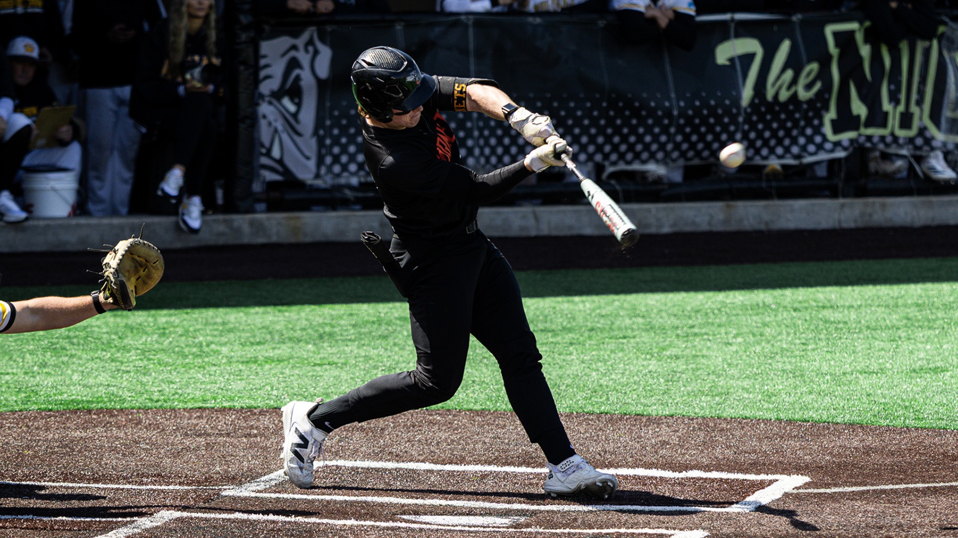 Caleb Moore hitting a baseball