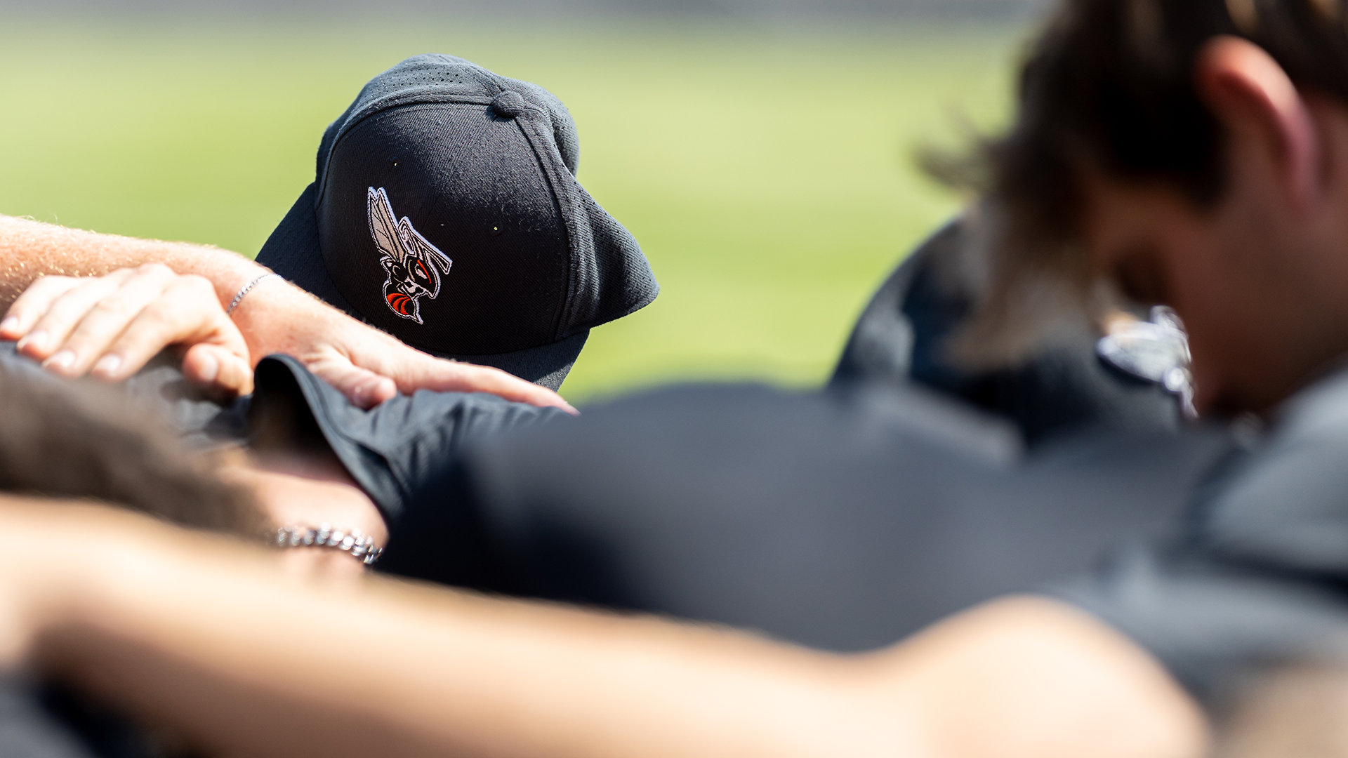 The Kalamazoo College baseball team huddled before a game at Woodworth Field