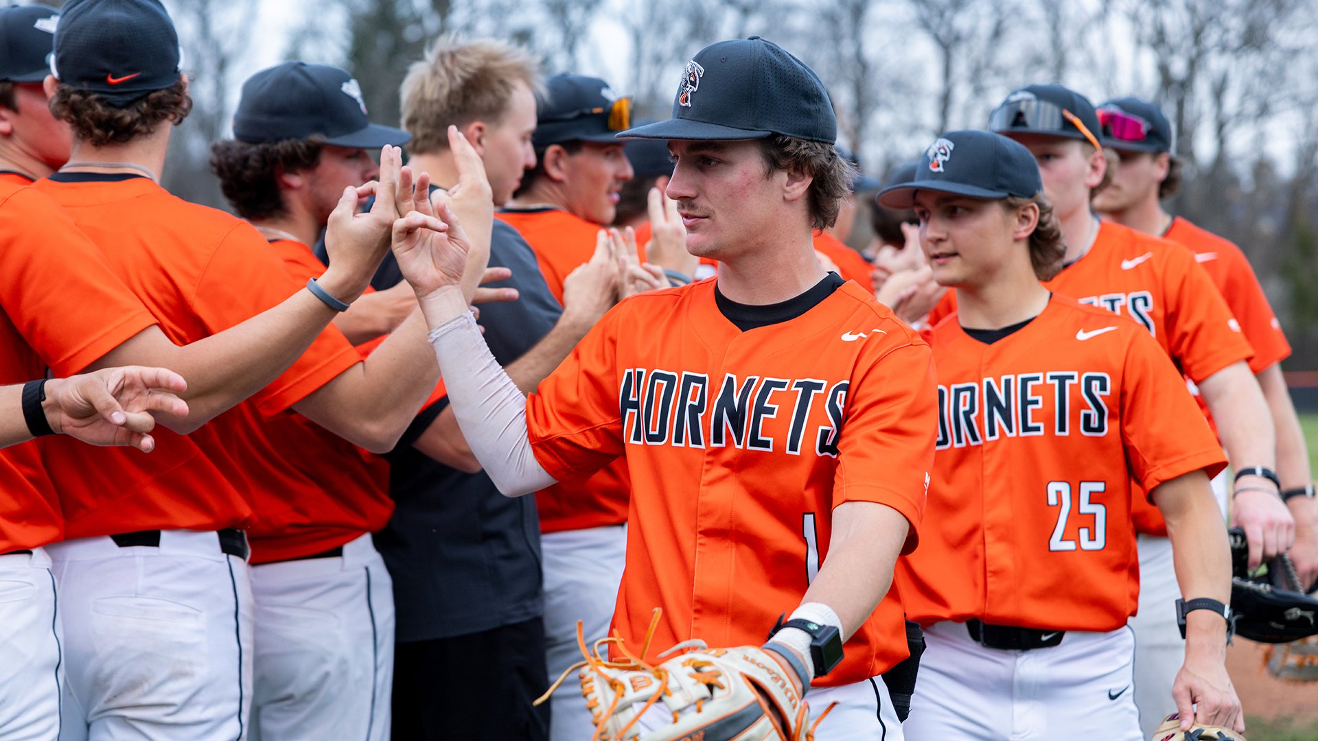 The Kalamazoo College baseball team celebrating a win