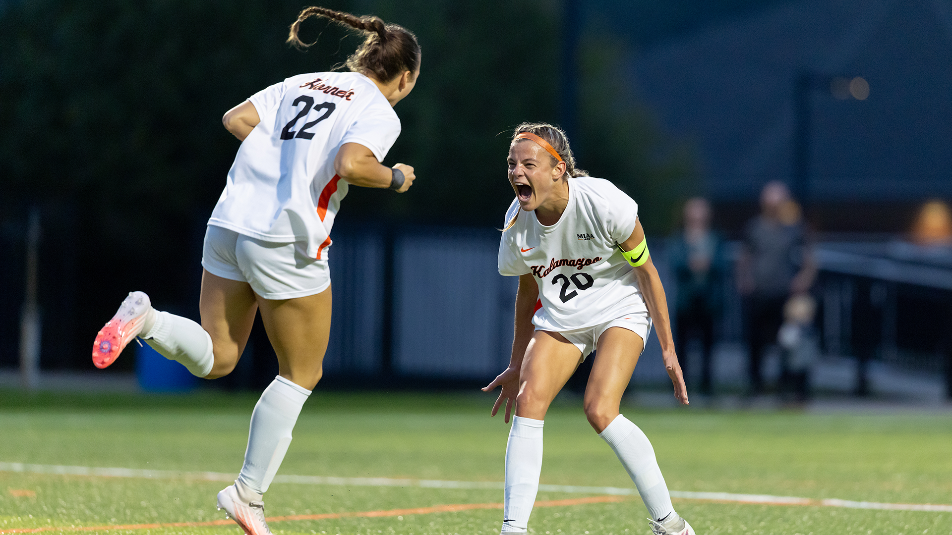 Ruby Hogan celebrating a goal with Savannah Norman
