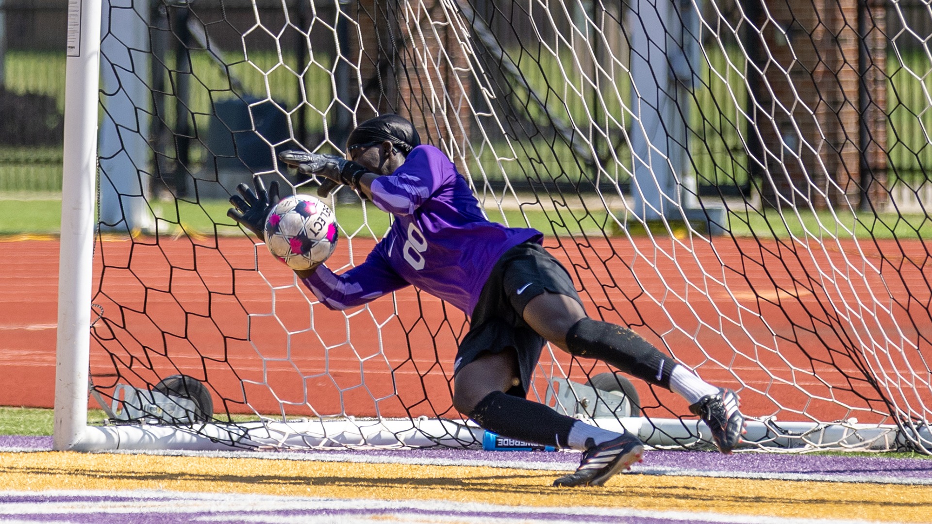 David Oyebade makes a diving save on a PK