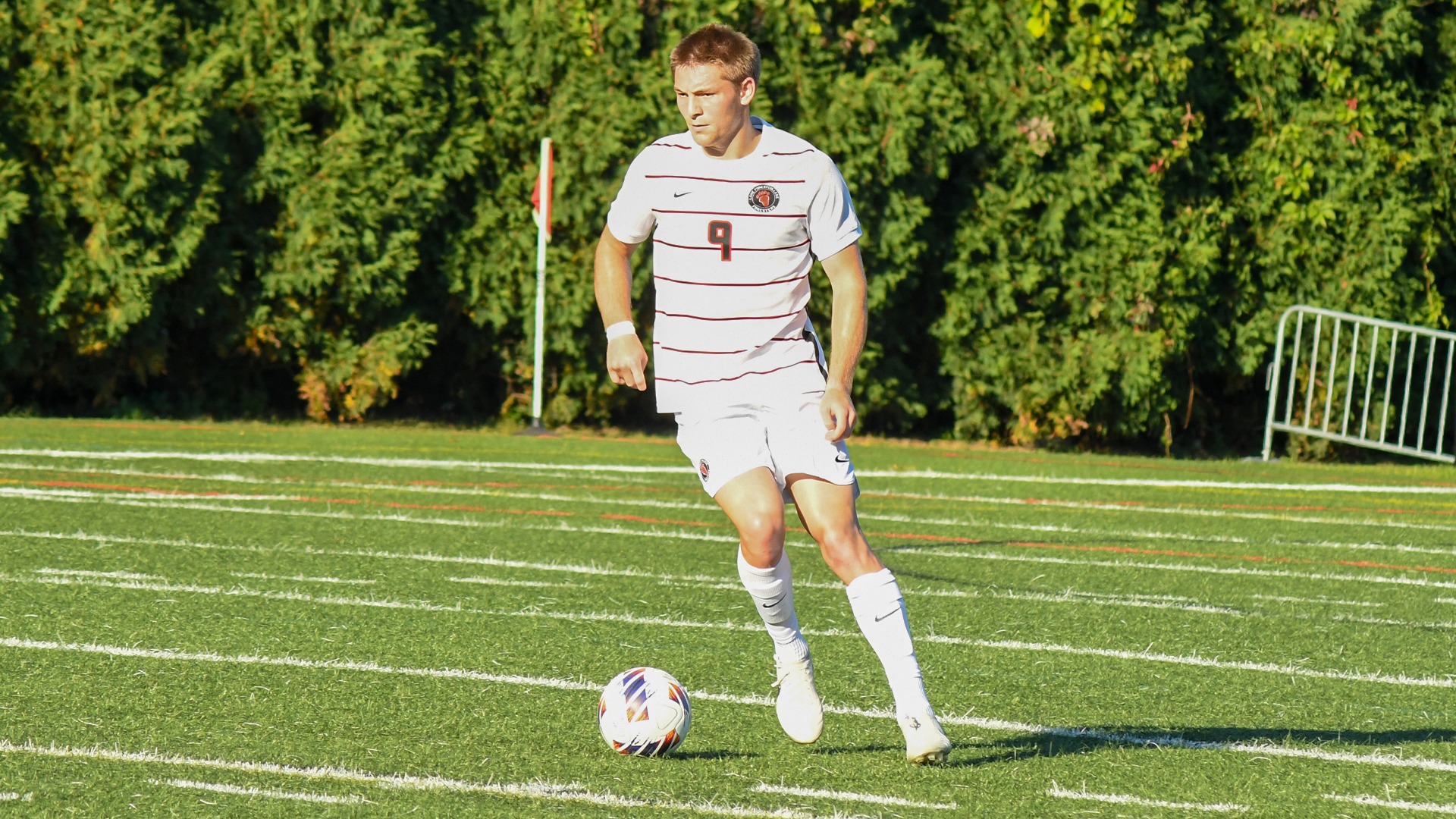 Sam Satisky dribbles the ball in a match against Elmhurst University