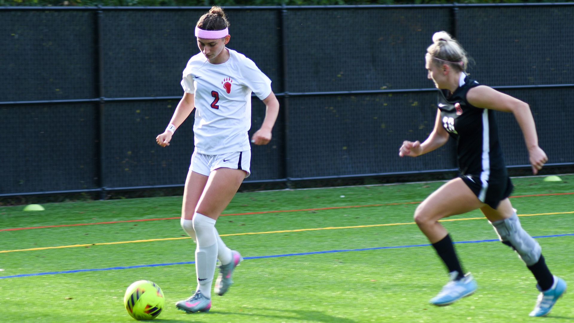 Ella Chicone dribbles a ball