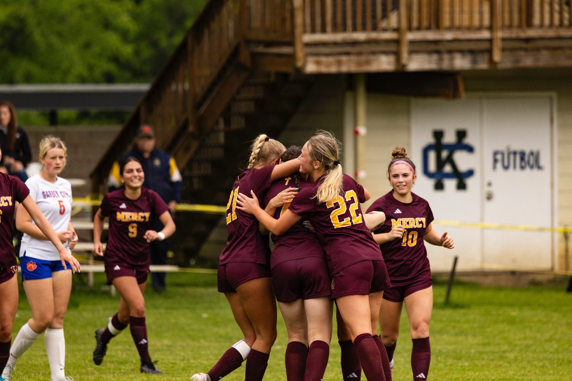 Mercy Varsity Soccer celebrates goal during MHSAA District semi game