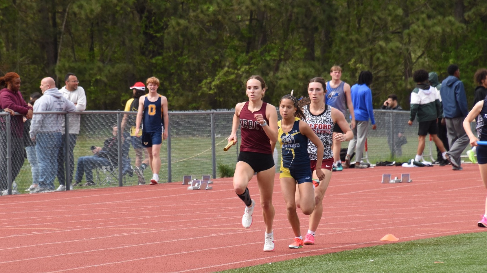 Libby Gerzema running 4x800 relay at 2026 MHSAA Regionals