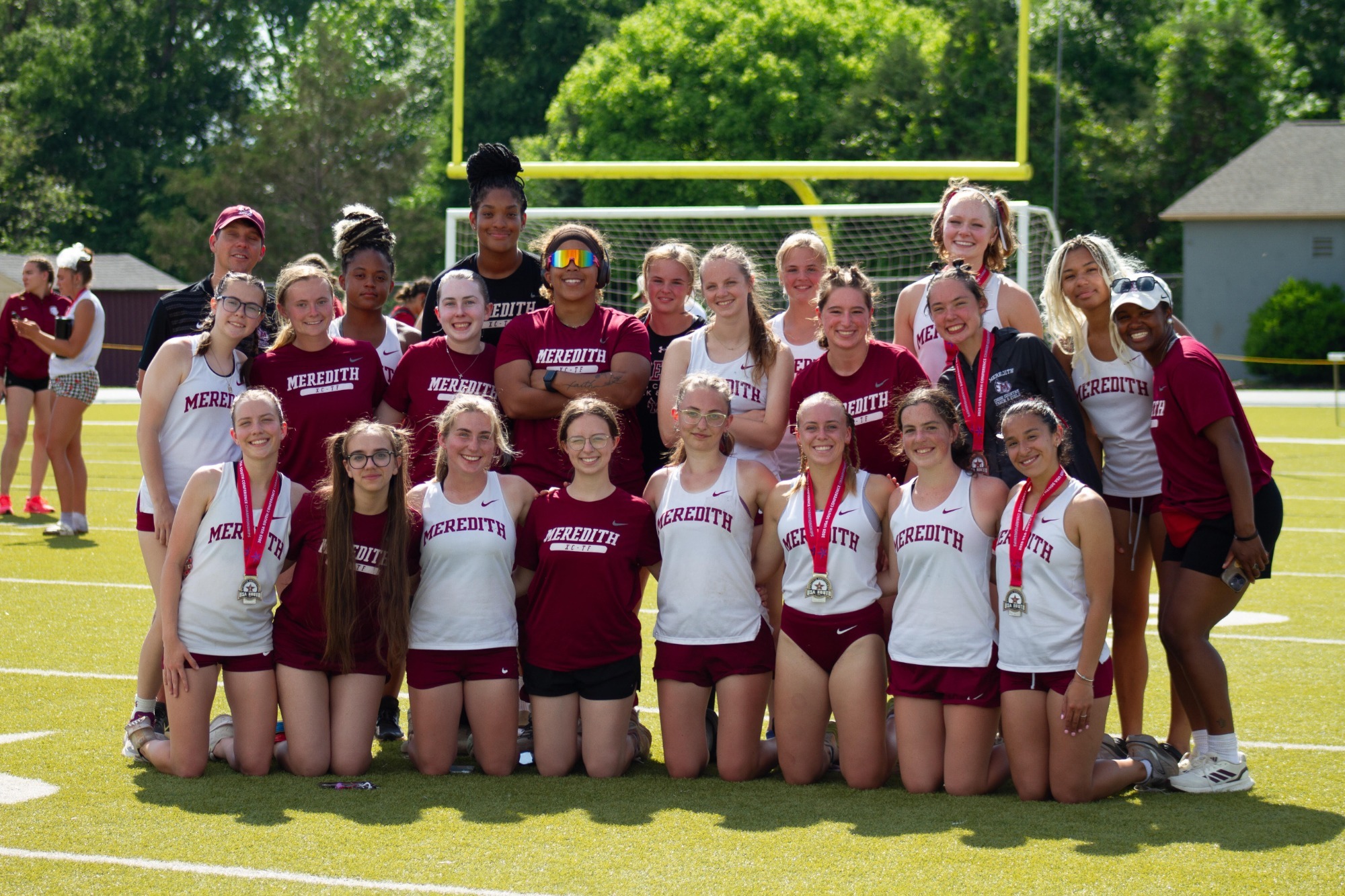 Outdoor Track and Field Post Race Team Photo with Medals 
