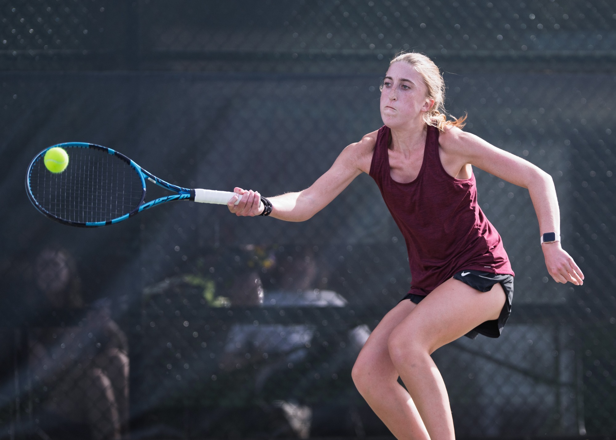 Claire Southern Returning a serve against Salem College