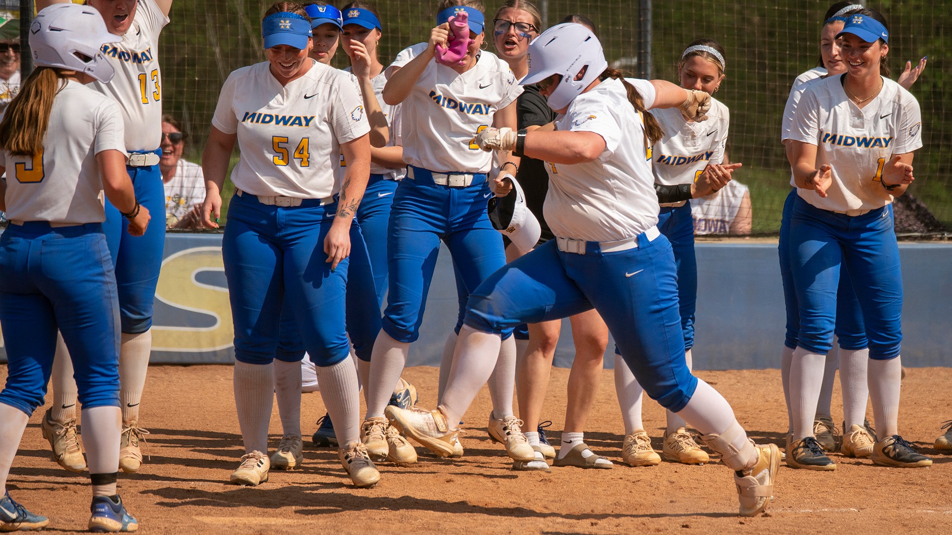 Midway softball celebration photo vs. Brescia (March 26, 2026)
