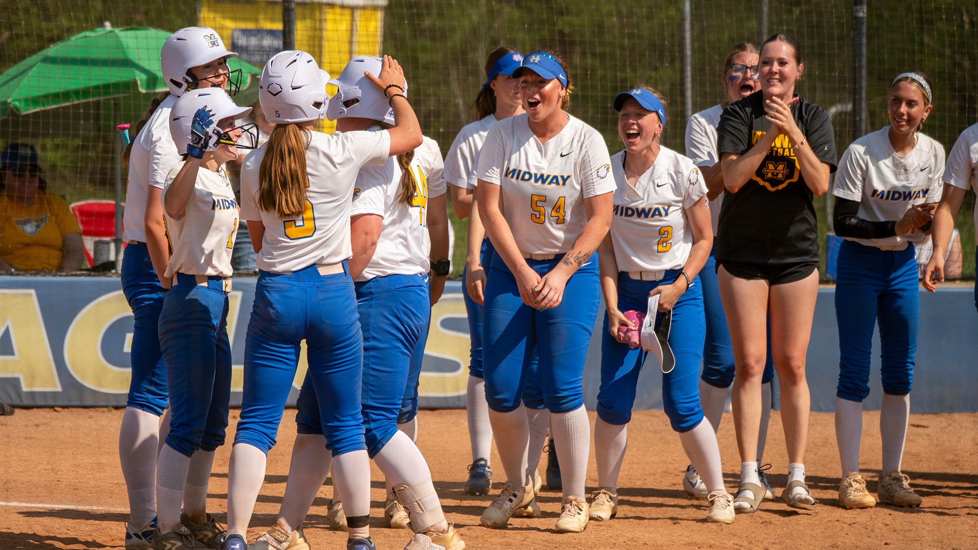 Softball celebration photo for IUS recap