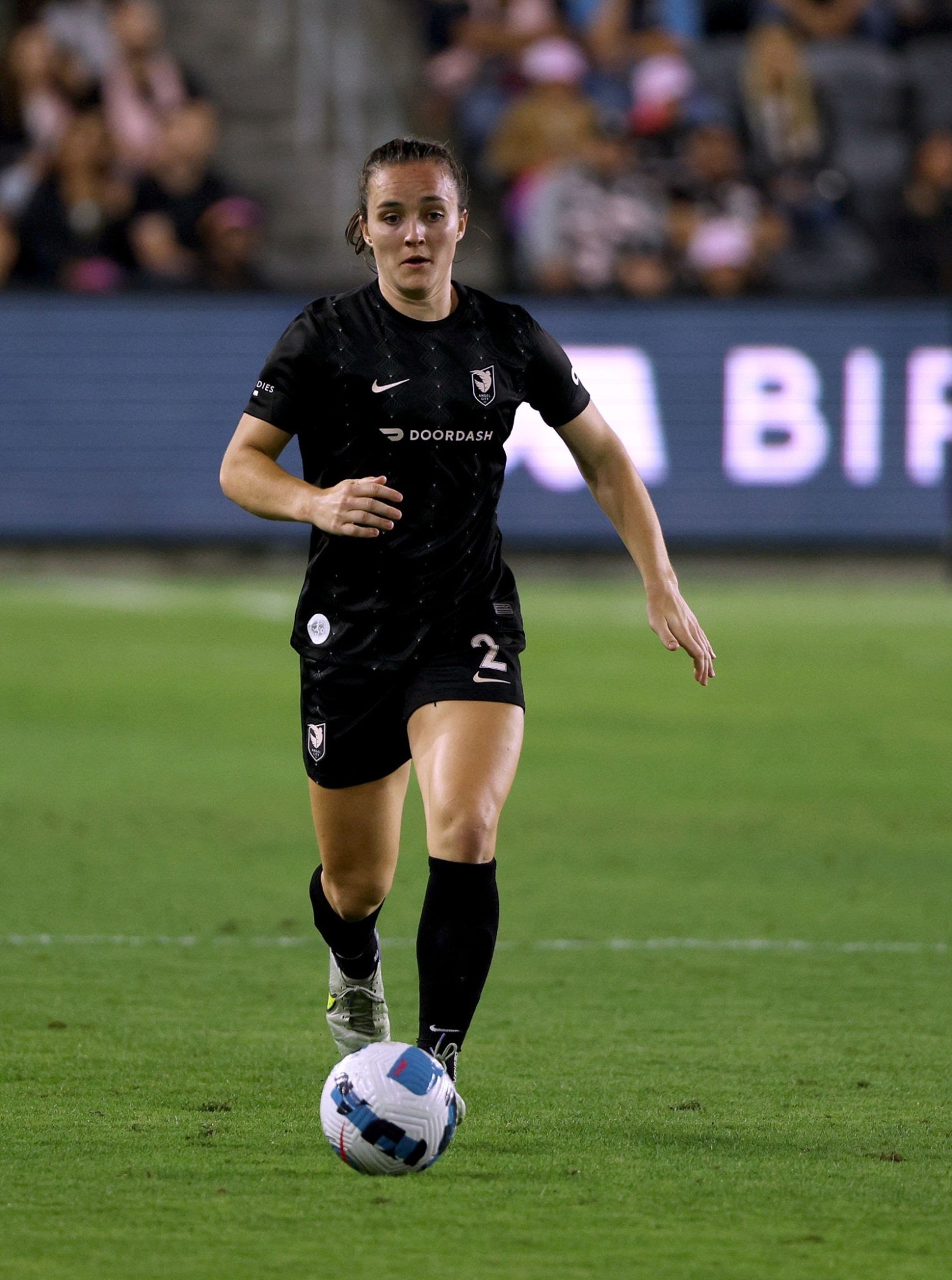 LOS ANGELES, CALIFORNIA - JUNE 07: Megan Reid #2 of Angel City FC dribbles the ball during the game against the Houston Dash at Banc of California Stadium on June 07, 2022 in Los Angeles, California. (Photo by Harry How/Getty Images)