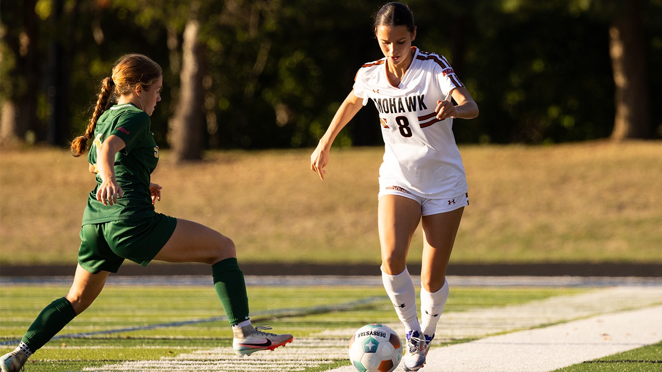Emily Schwarz dribbling passed a defender