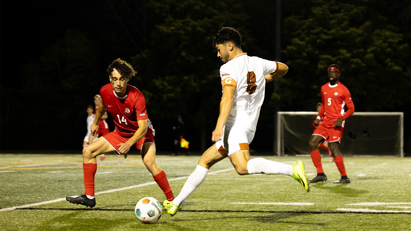 Luc Sabatino kicking the ball down field
