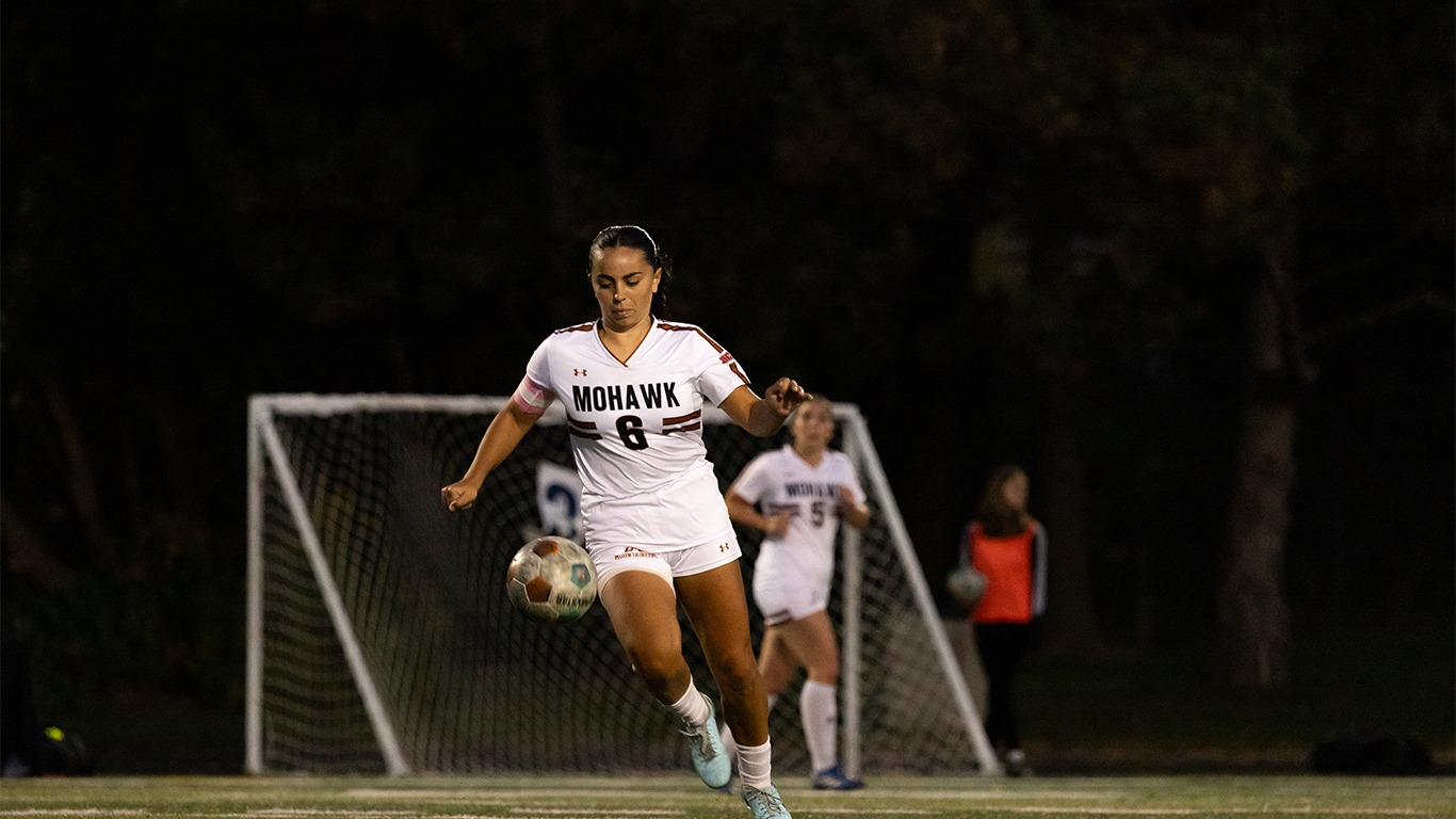 Grace McLellan plays the ball