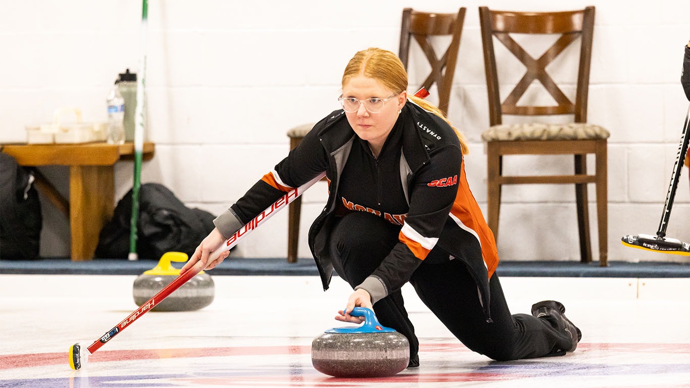 Madison Babcock throwing a rock for Mohawk