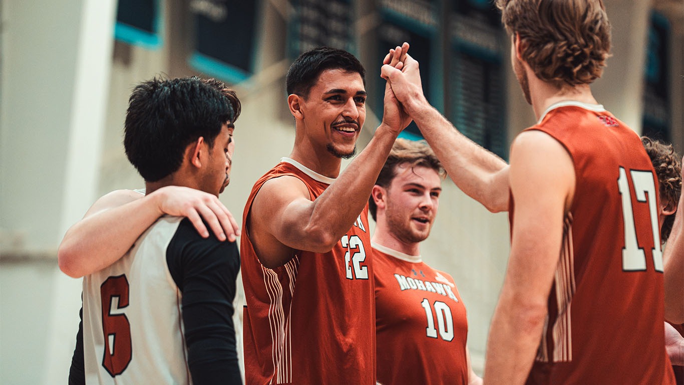 Marthus Guedes high fiving teammate Alex Jurak