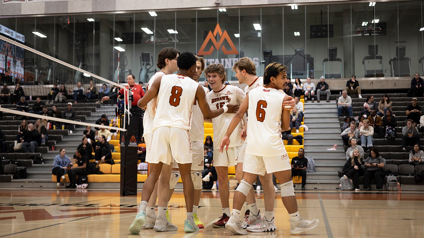 Men's volleyball huddles
