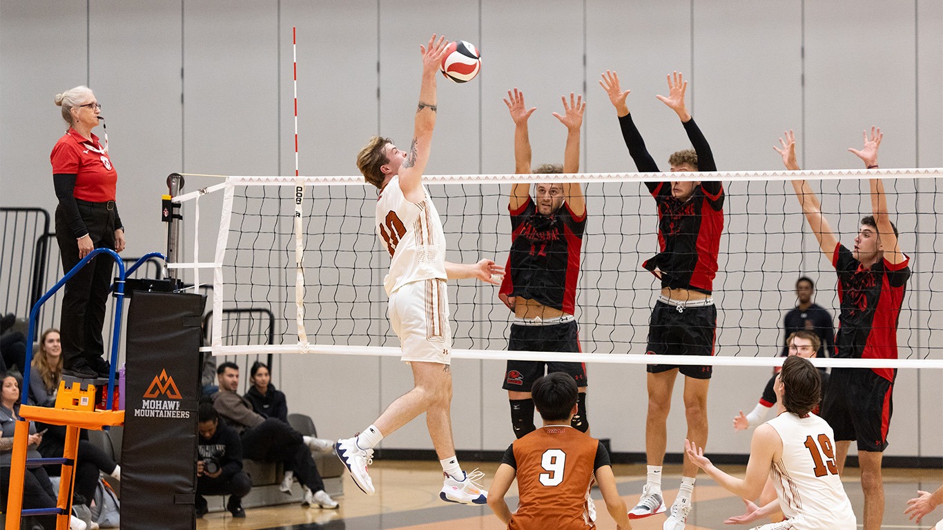 Dean Zicari swinging versus the Fanshawe block