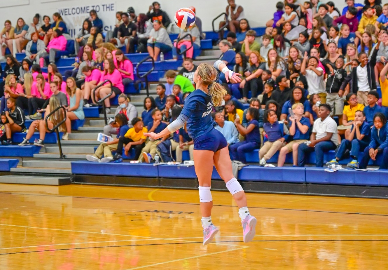 Emilee Wilson serves vs. Regent