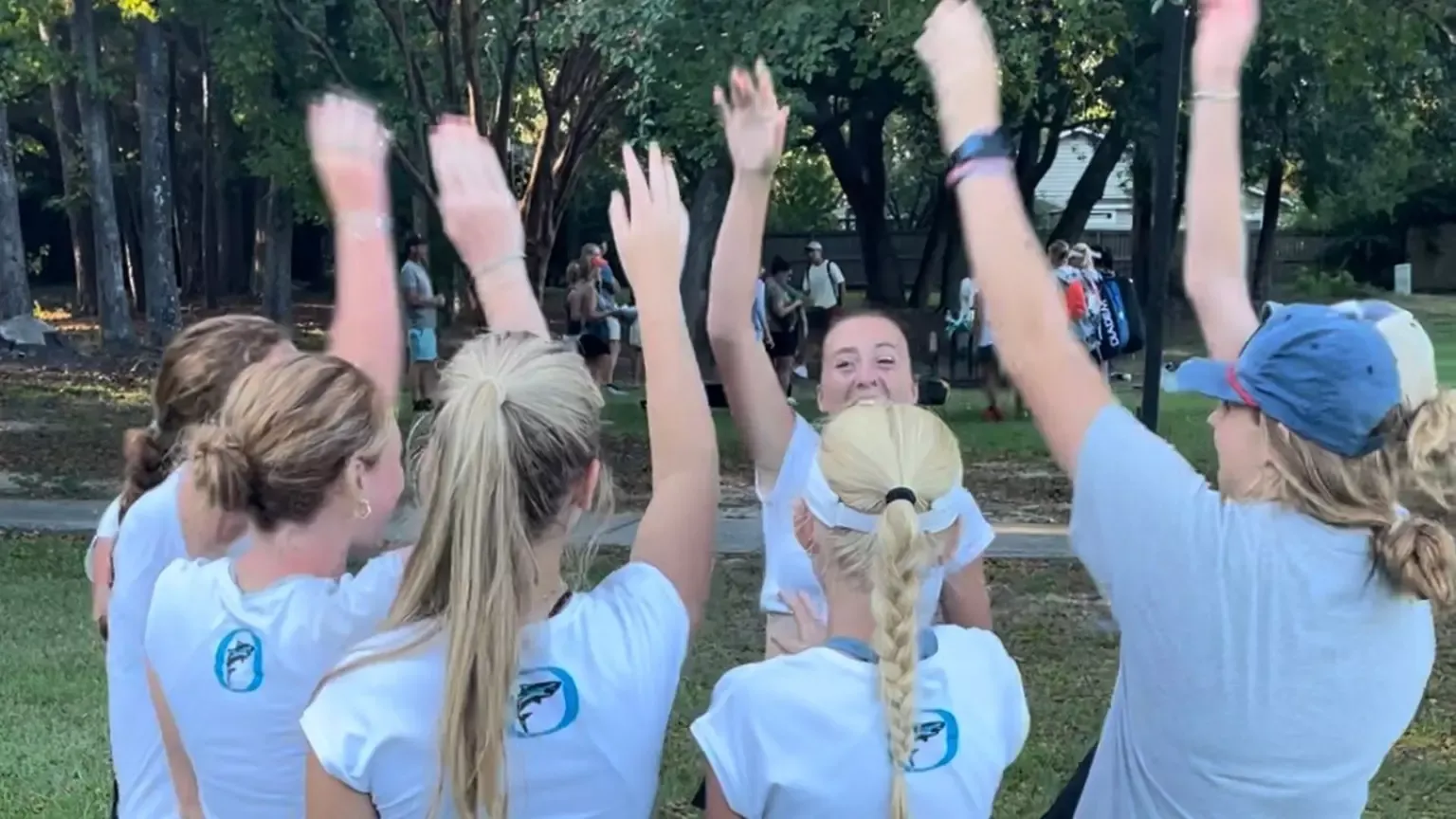 girls tennis team celebrates