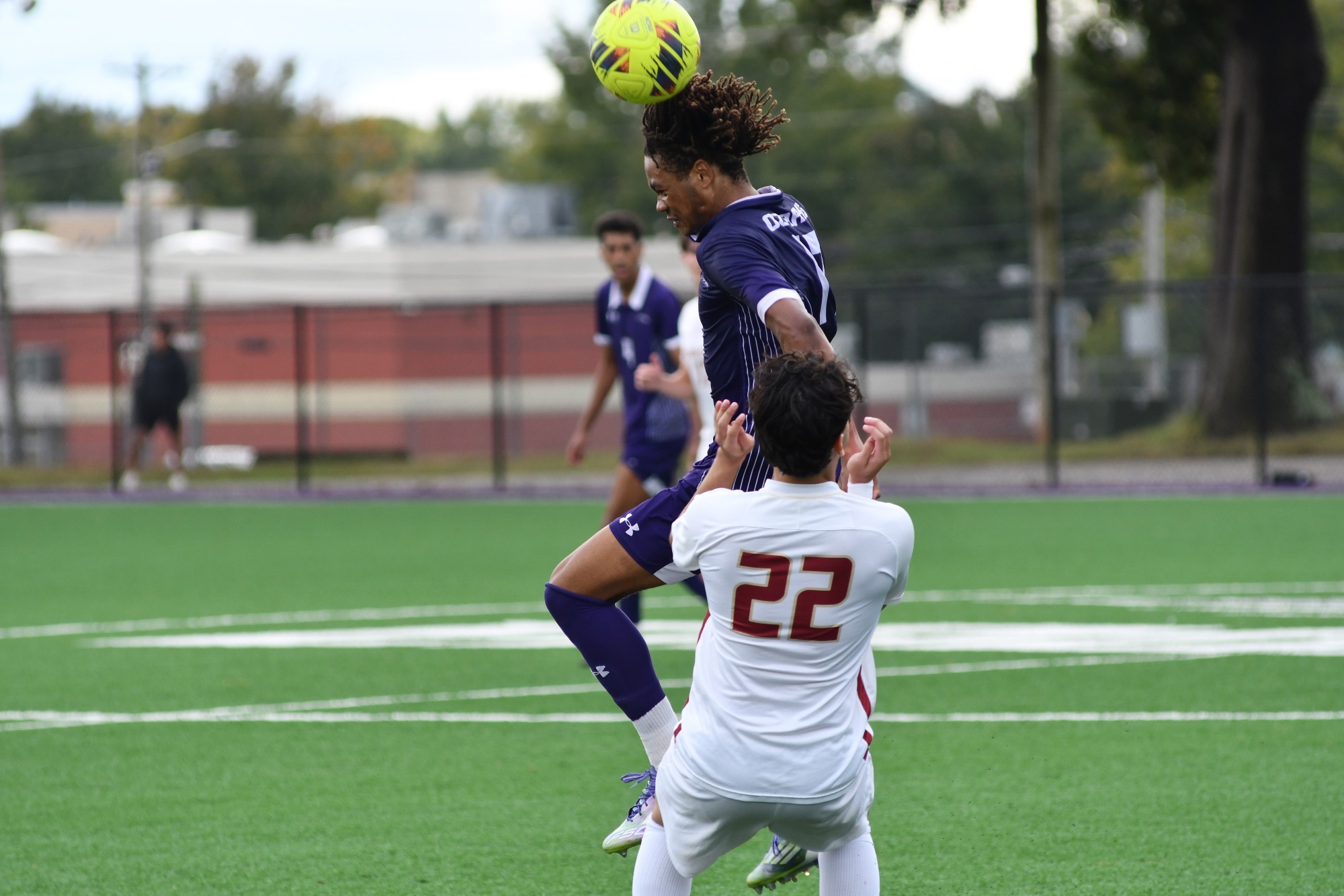 Martin Hale heads a ball against Austin College.