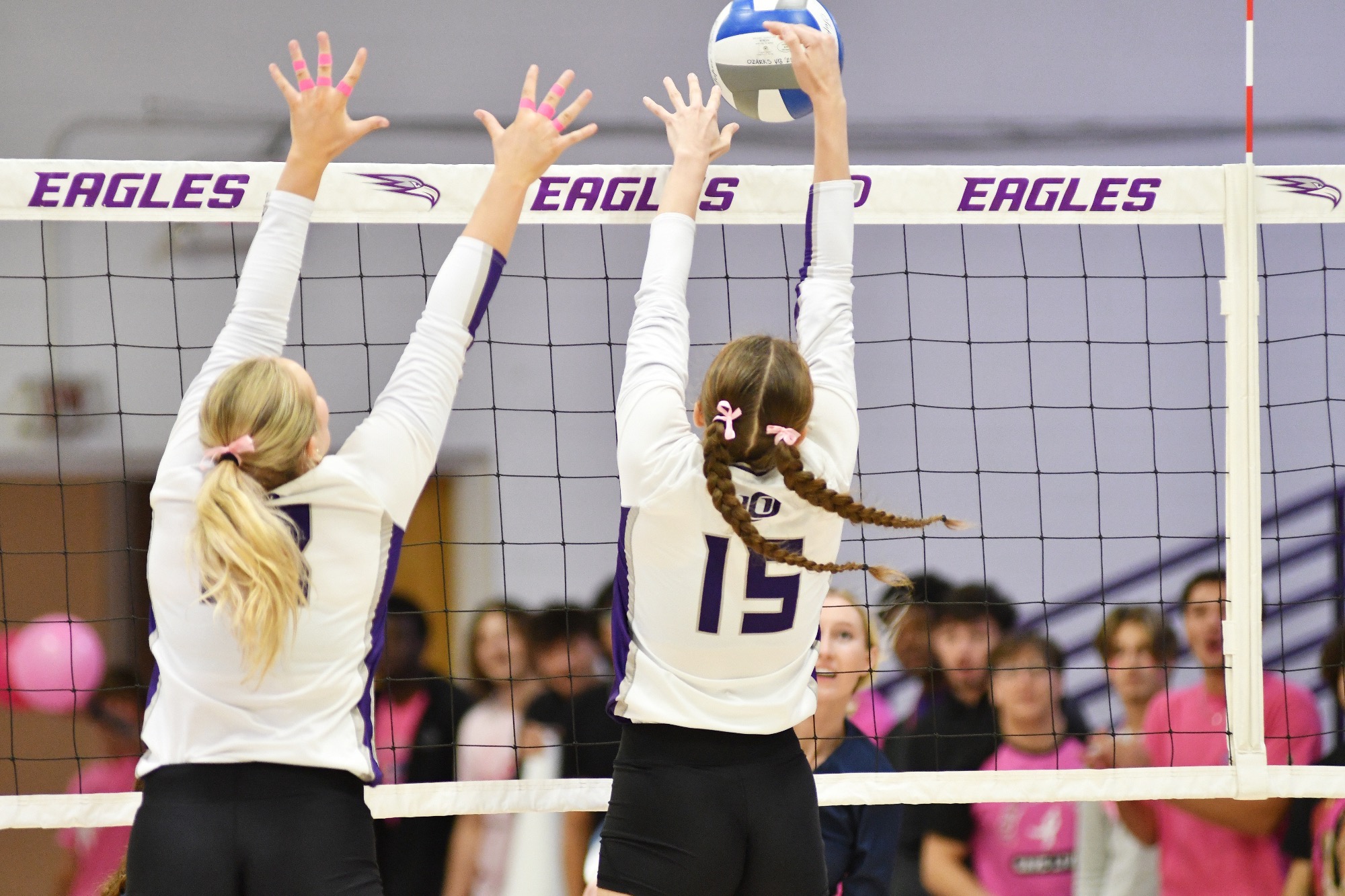 A pair of Eagles block a Lyon College attempt.
