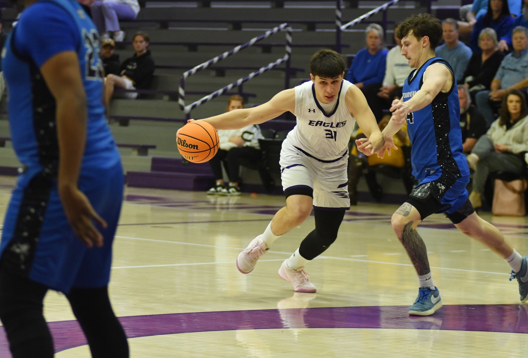 Vanya Nikolic dribbles around a defender.