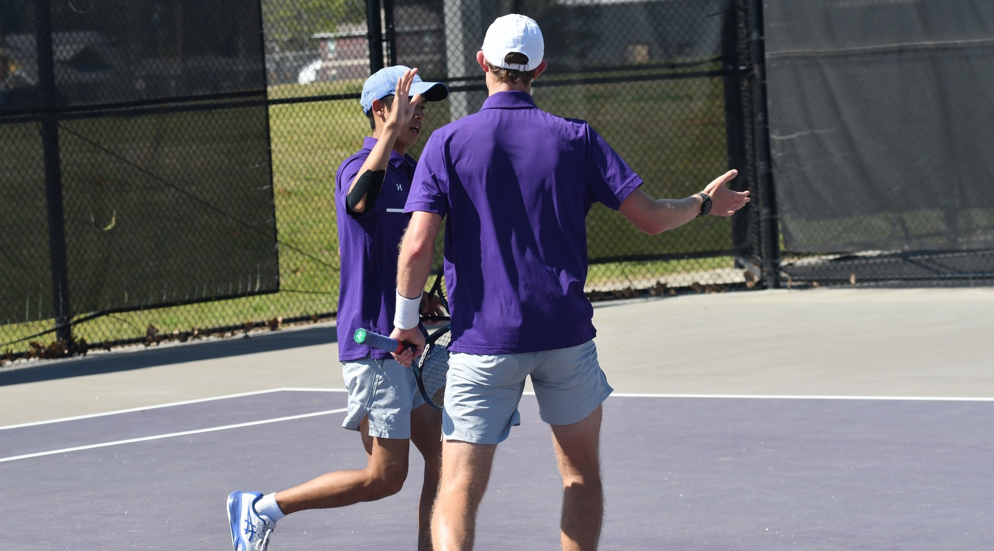 Kento Iwahara and Joseph Guidry celebrate a point.