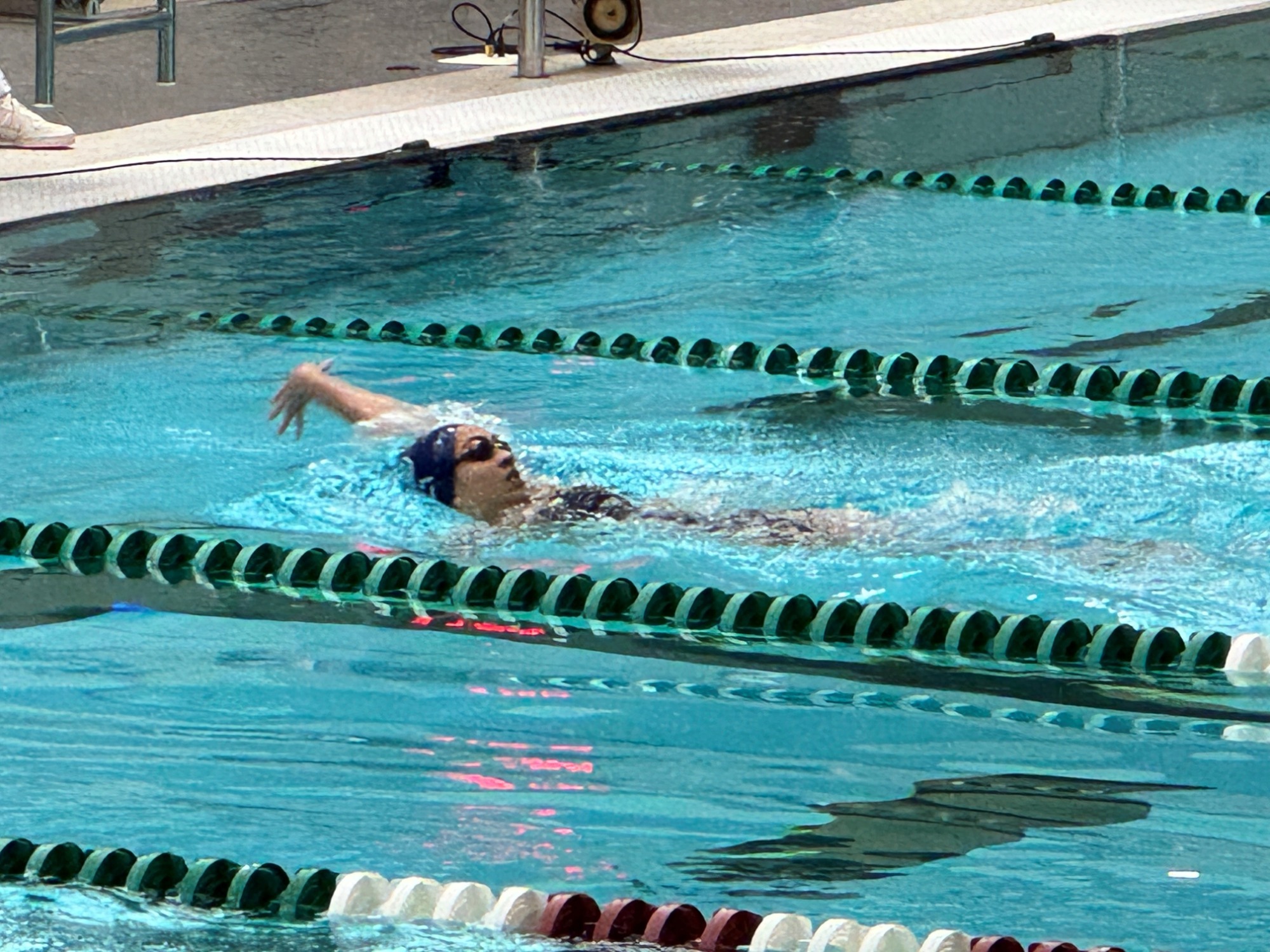 Girl swimming backstroke