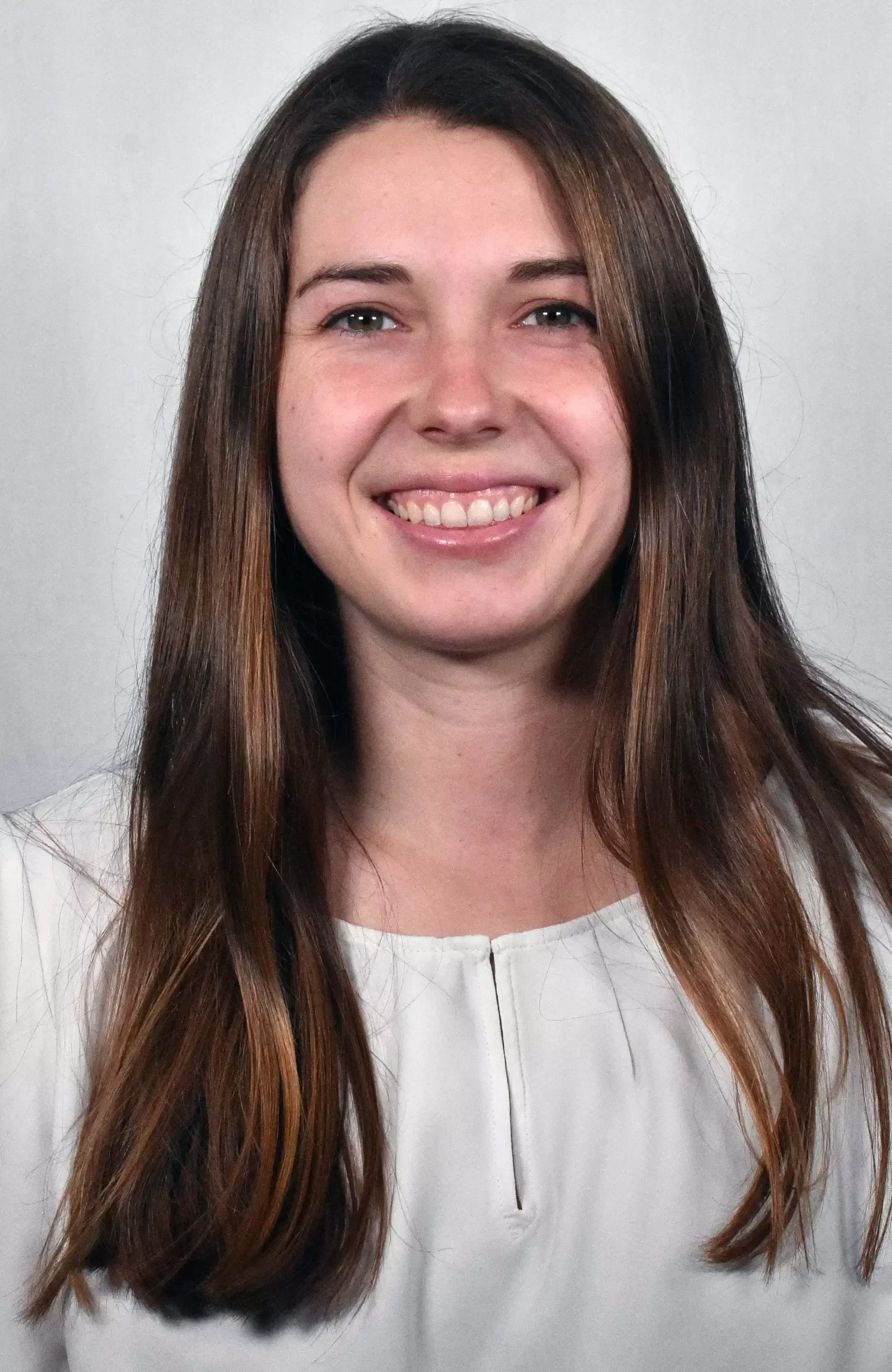 WOMEN'S BASKETBALL: Assistant Coach Caitlin Kriesel-Bigler headshot. 