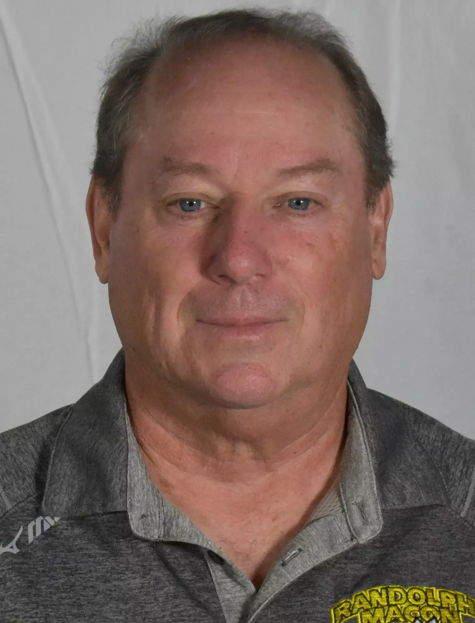 WOMEN'S VOLLEYBALL: Head Coach Bill Rogers (grey polo) Headshot 2023.
