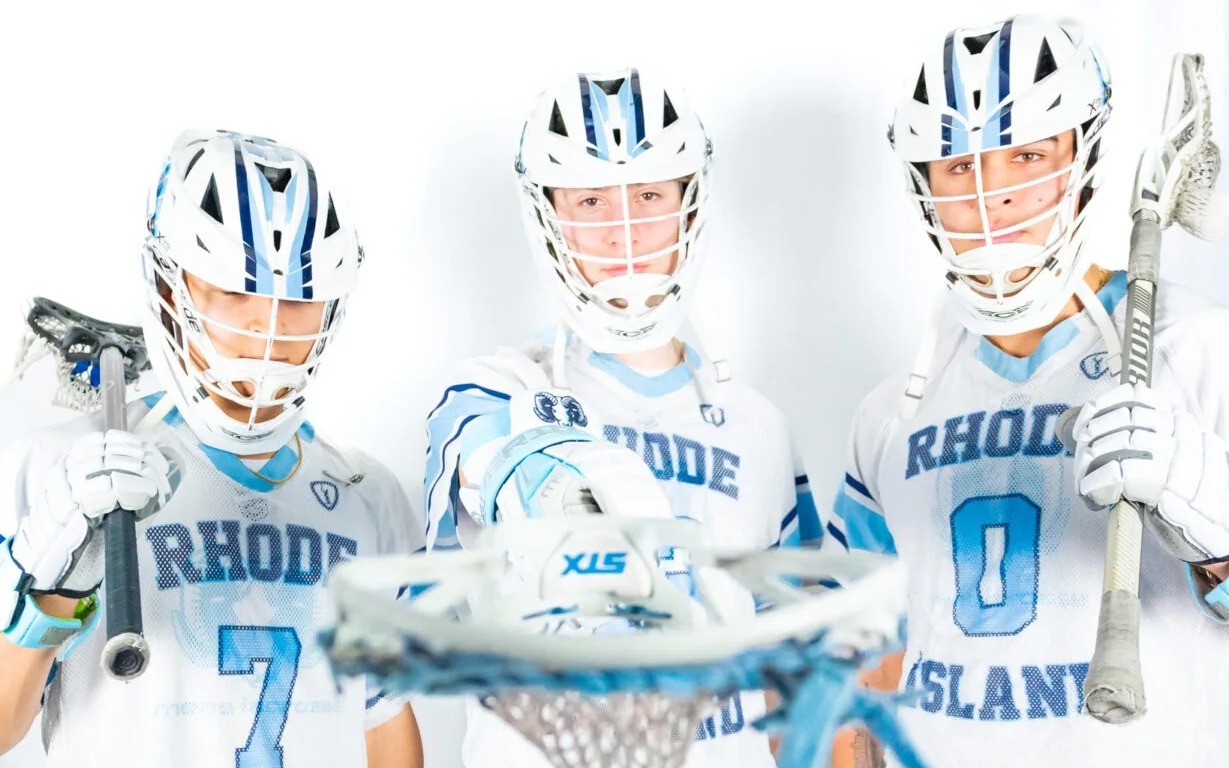 Three men's lacrosse players during media day