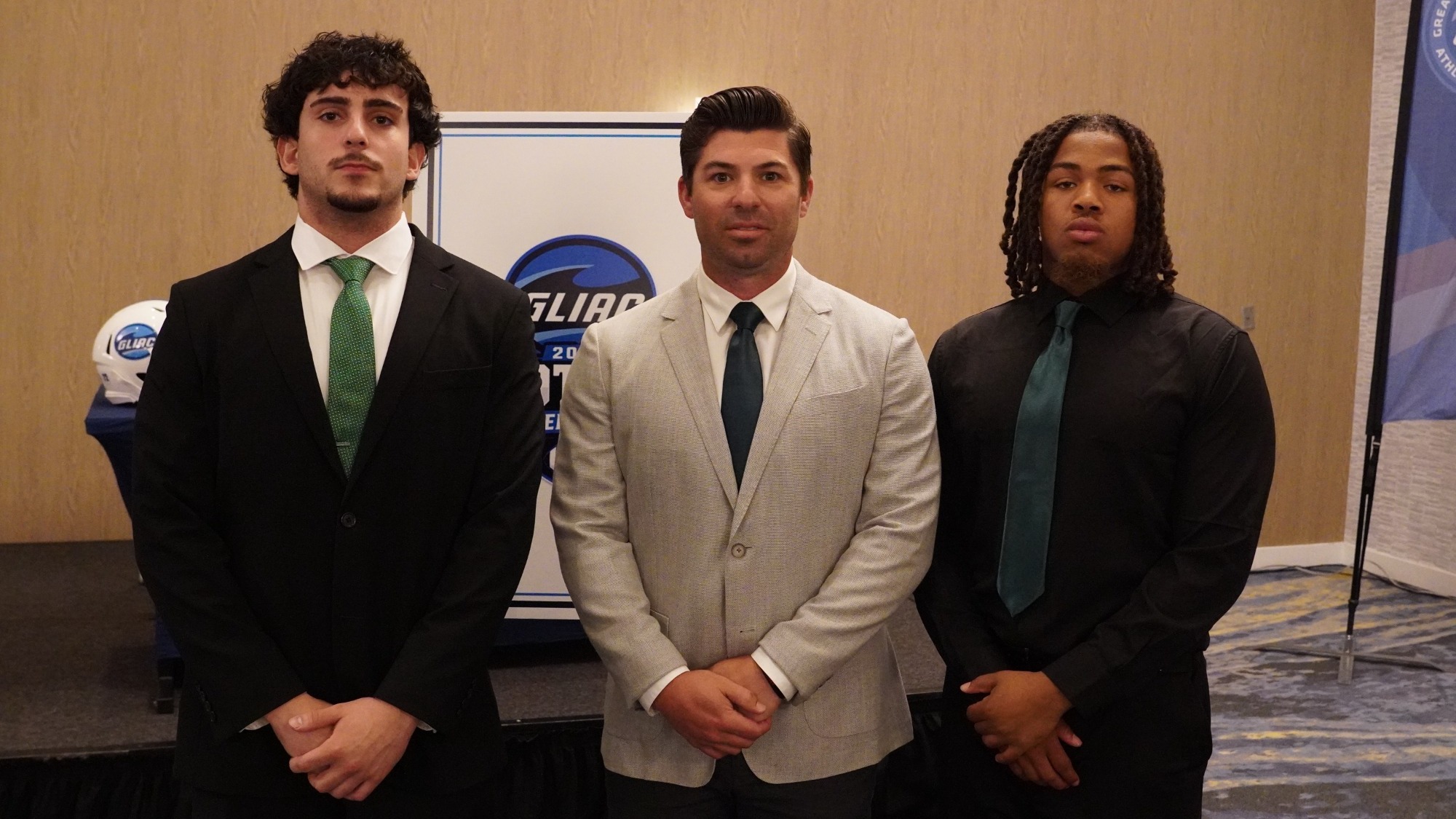 Roosevelt quarterback Tony Chahino, head coach Billy McKeon and linebacker Brandon Harvey at GLIAC Media Day