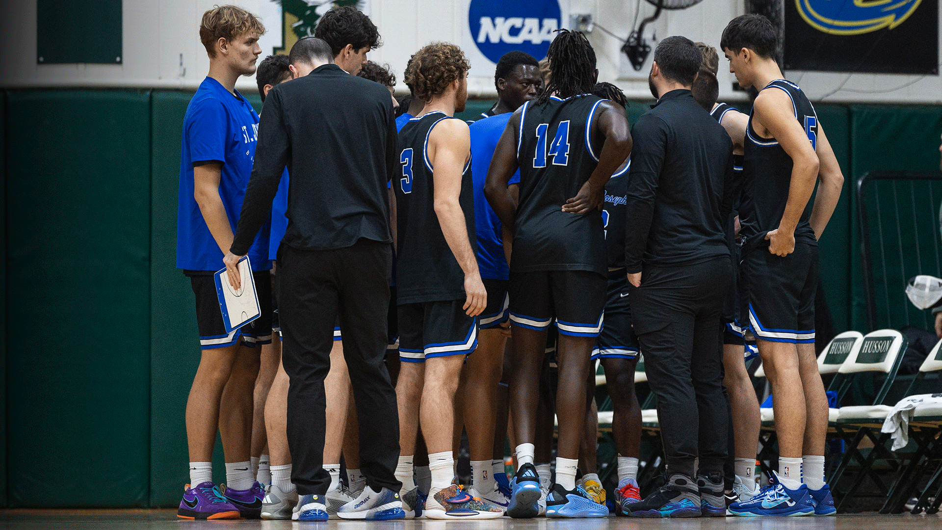 Men's basketball huddle