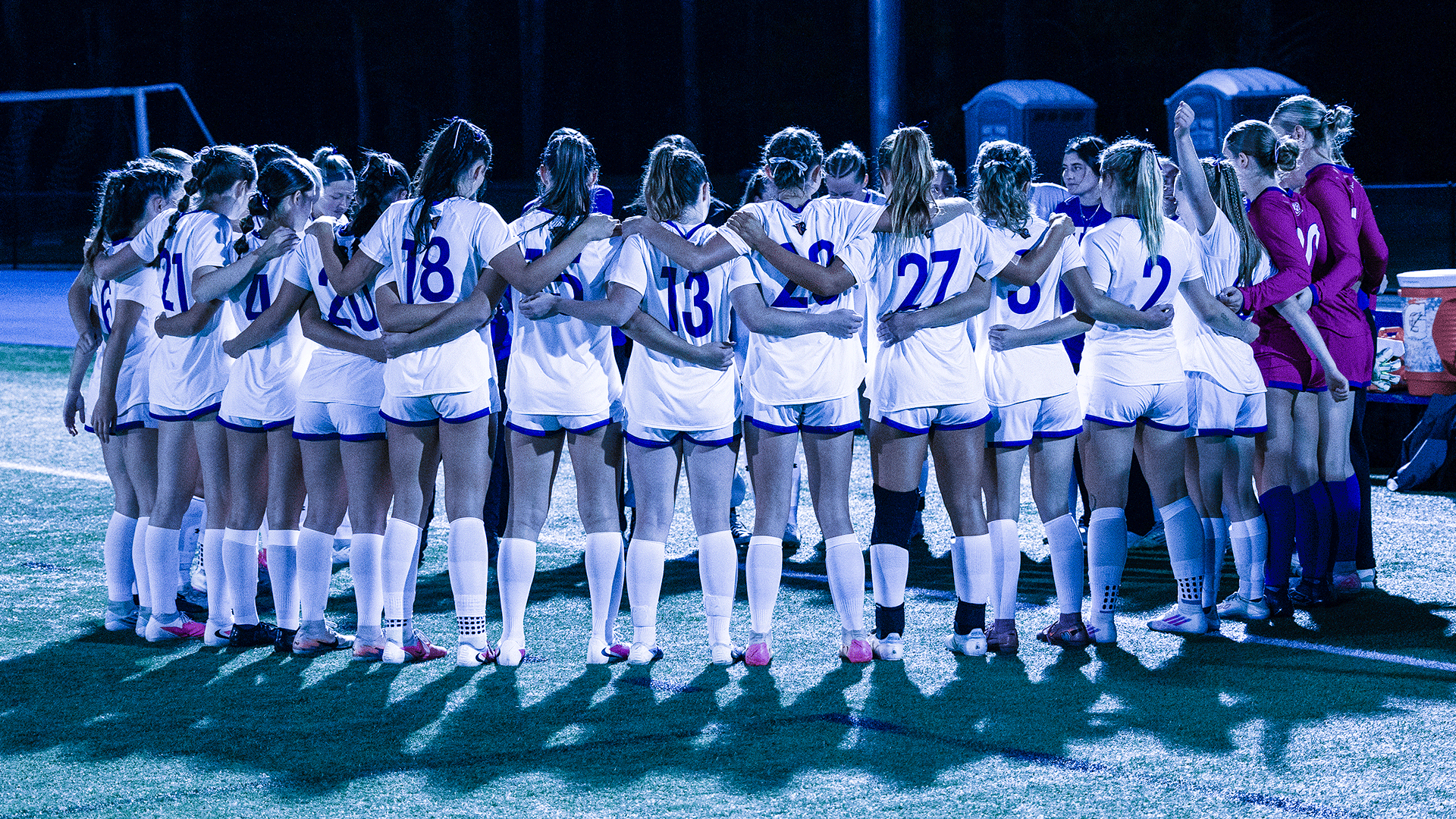 Women's soccer team huddle