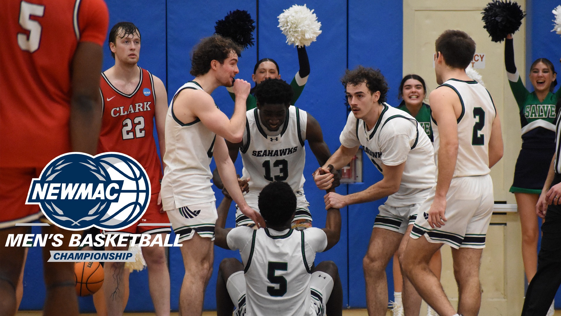 Francoeur gets a lift from teammates after finishing scoring with a three-point play