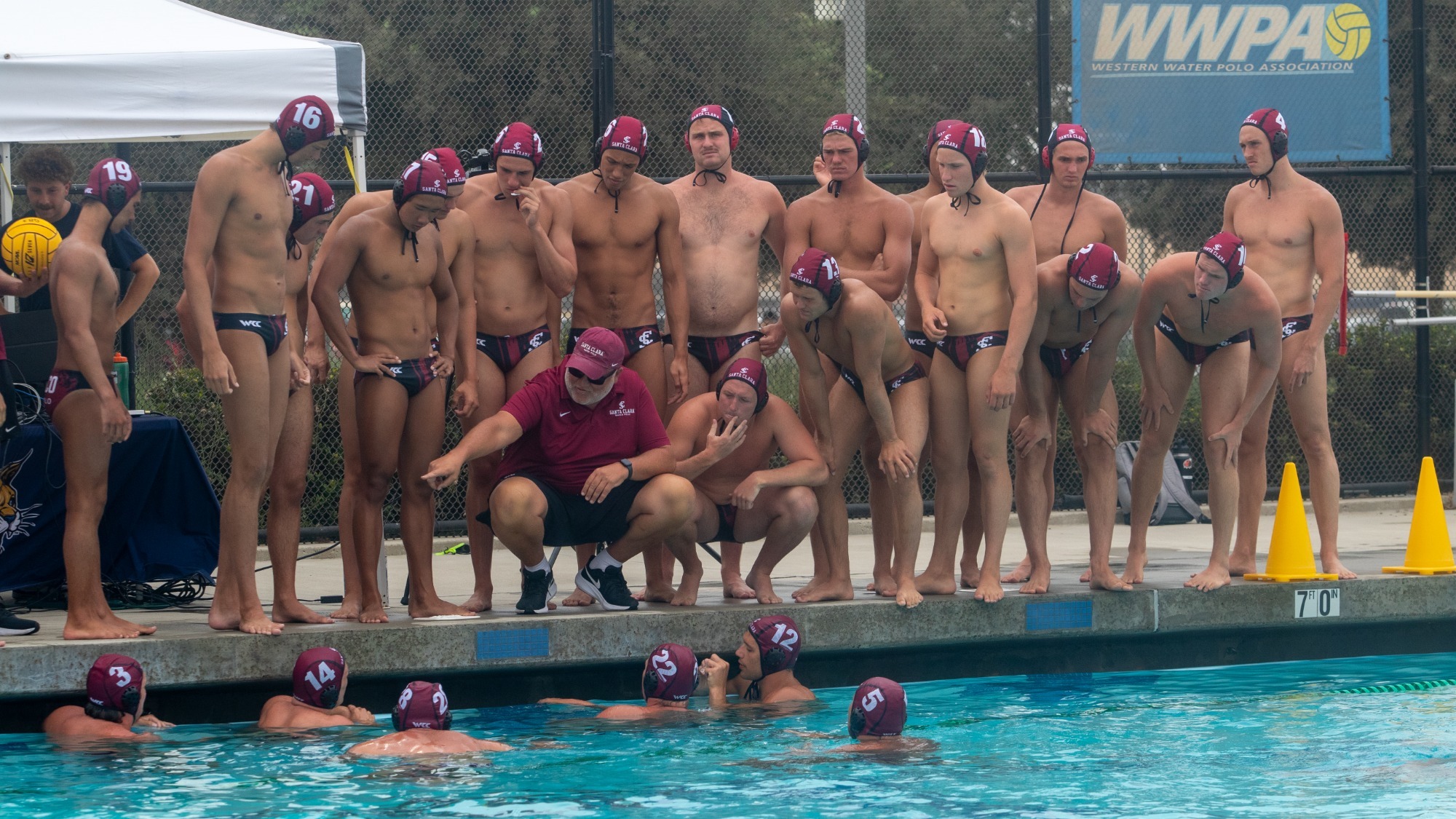 Wilbur, Keith and 2026 team during a timeout