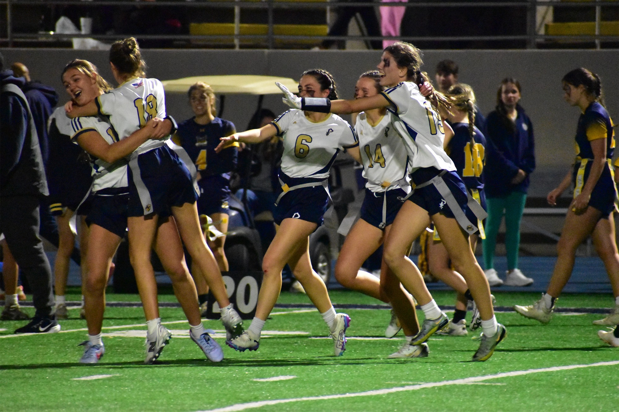 Golden Lion Flag Football Players Celebrating