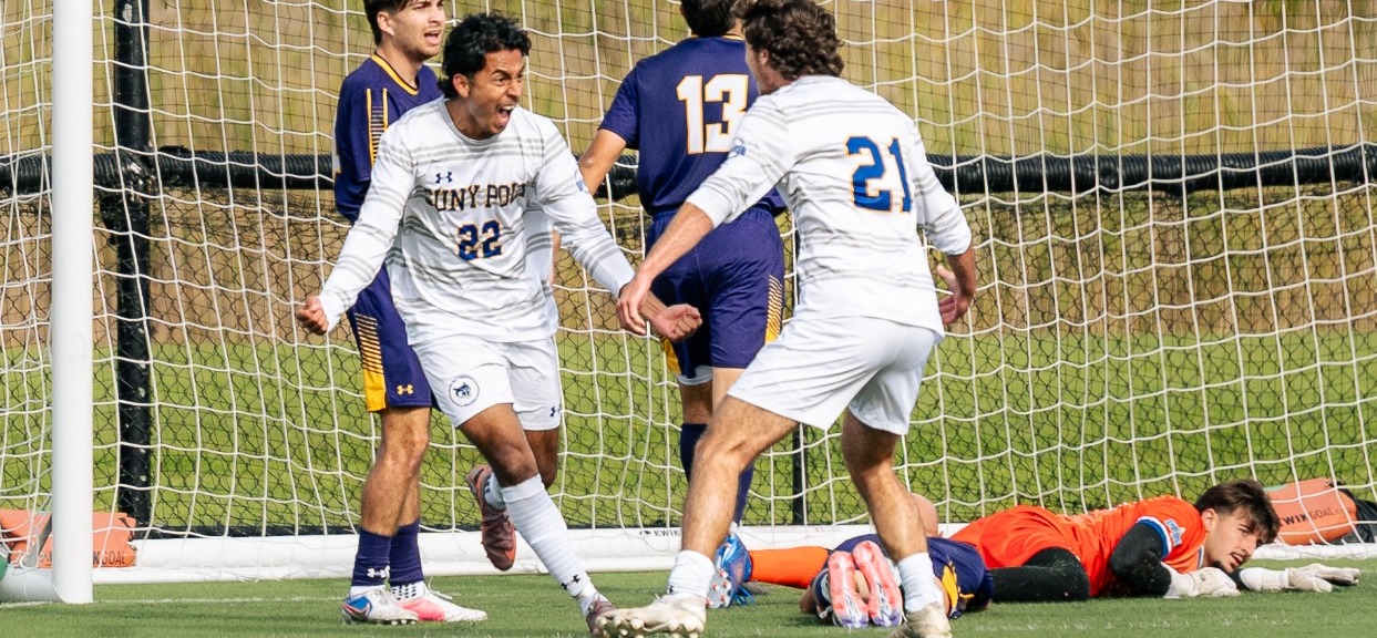SUNY POLY men's soccer players celebrate after scoring game-winning goal in final minutes