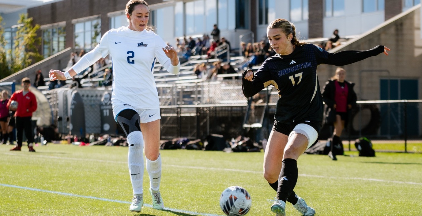 SUNY POLY women's soccer player defends against incoming defender